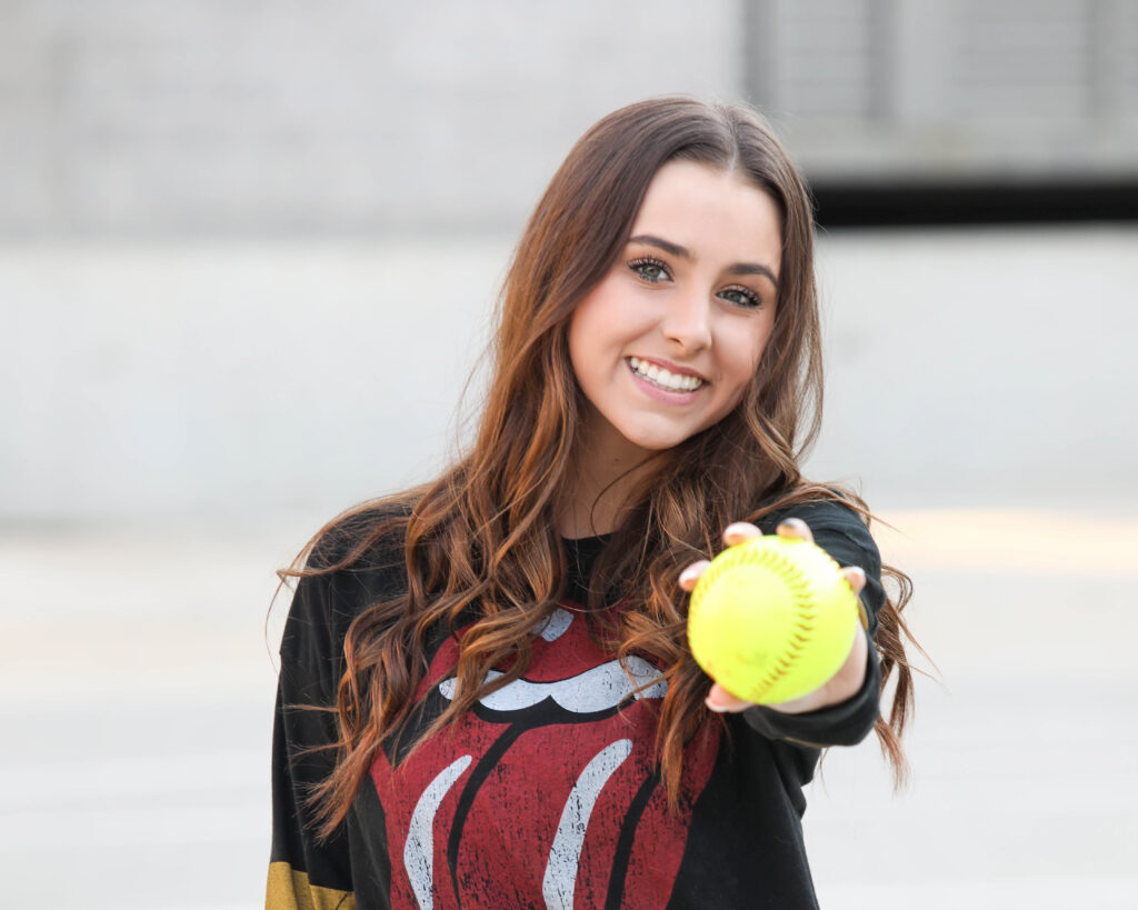 Portrait of a confident tween girl smiling during a 'Bloom Your Own Way' photo session. The image captures her radiant personality and self-assuredness, highlighting the beauty of celebrating individuality and inner strength before middle school