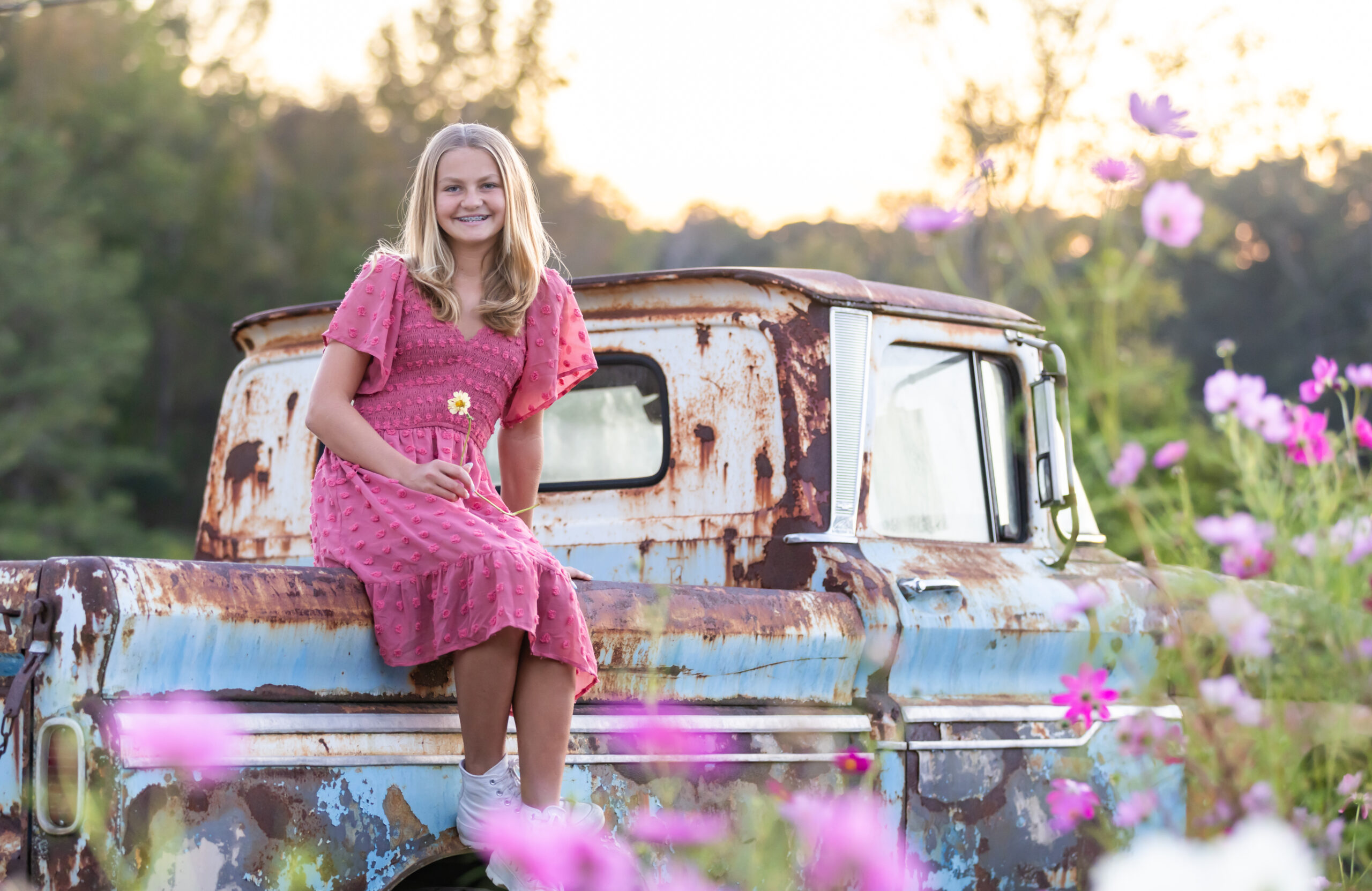 Preteen girl in flower field