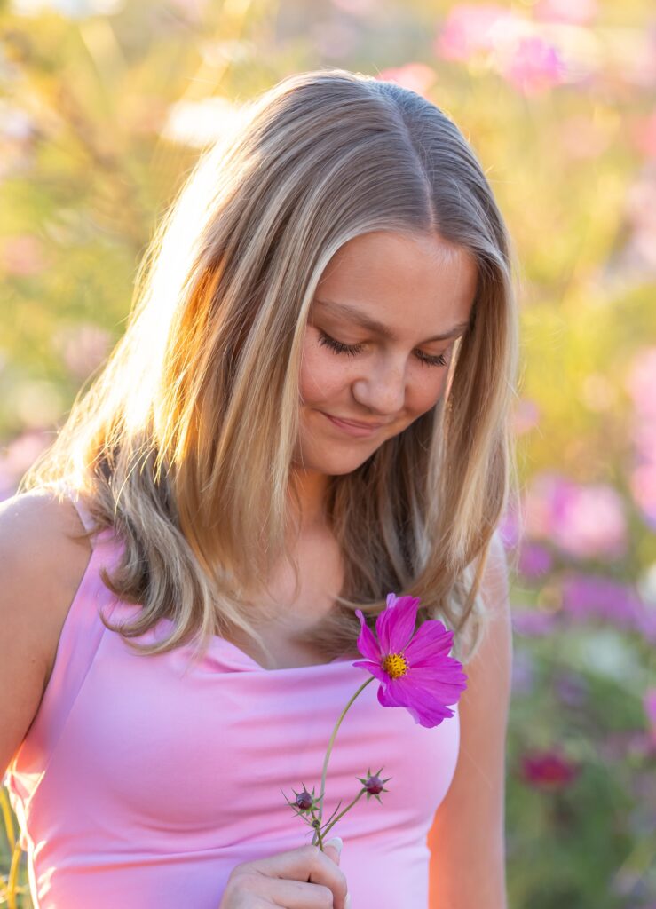 Young tween girl outside with flowers 
