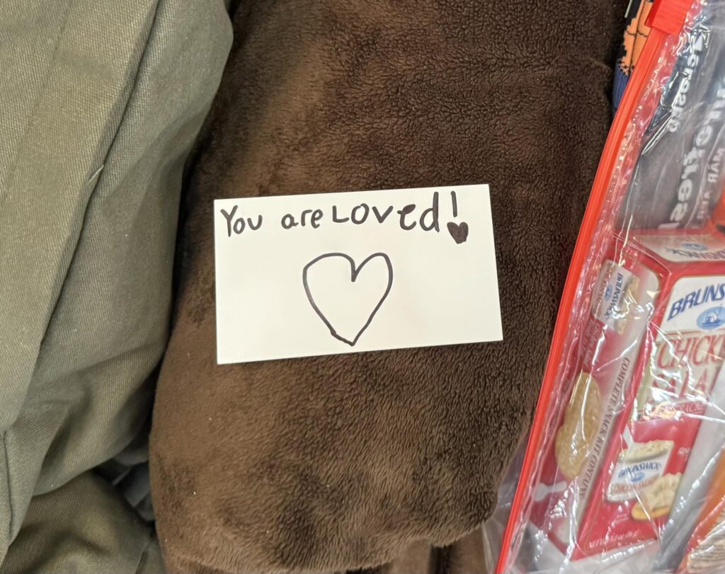 "You are loved" note left by a child in bag for someone living on the streets 