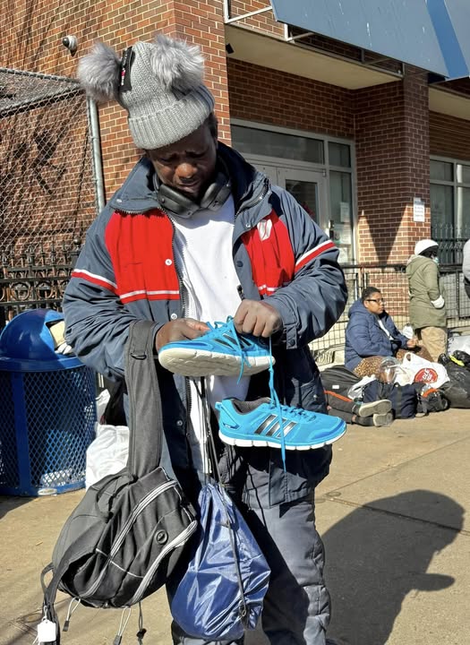 Man who is living on the streets is excited about his new shoes
